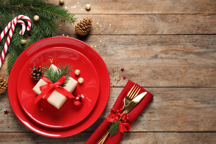 Beautiful Christmas table setting on wooden background, top view. Space for text