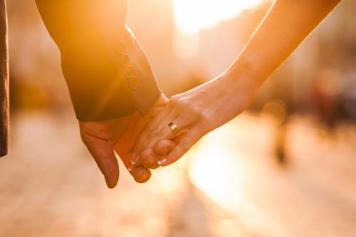 Beautiful couple holding hands