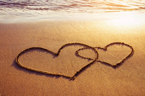 Honeymoons heart in the sand on the beach